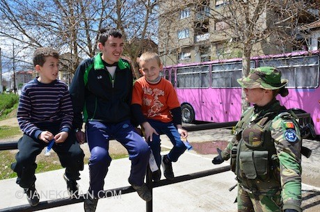 Three boys and a KFOR peacekeeper in Mitrovica, Northern Kosovo.  